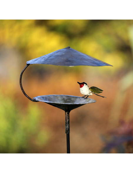Mangeoire pour les oiseaux avec chardonneret élégant aux ailes déployées-Mangeoire oiseaux sur pied